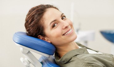 Female patient in dental chair visiting emergency dentist in Chevy Chase, MD
