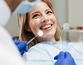 Lady smiles at dentist