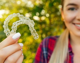 Lady shows off Invisalign clear aligners