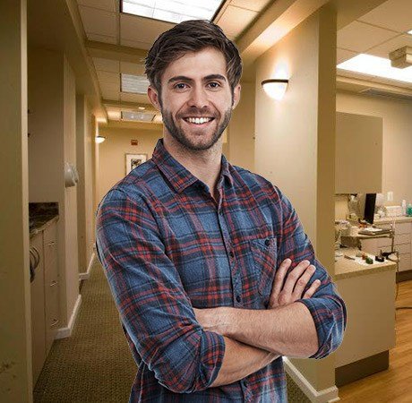 Young man smiling in dental practice
